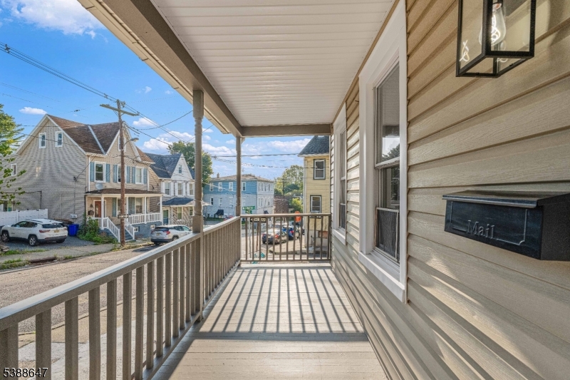 330 Chambers Street Phillipsburg, NJ 08865 - Photo 2 of 27 a view of a balcony with wooden floor and fence