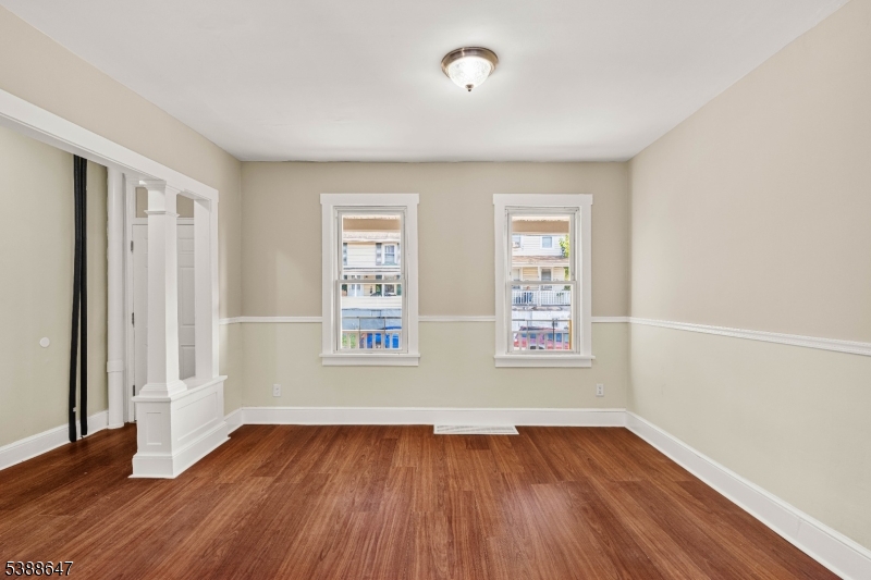 330 Chambers Street Phillipsburg, NJ 08865 - Photo 7 of 27 an empty room with wooden floor and windows