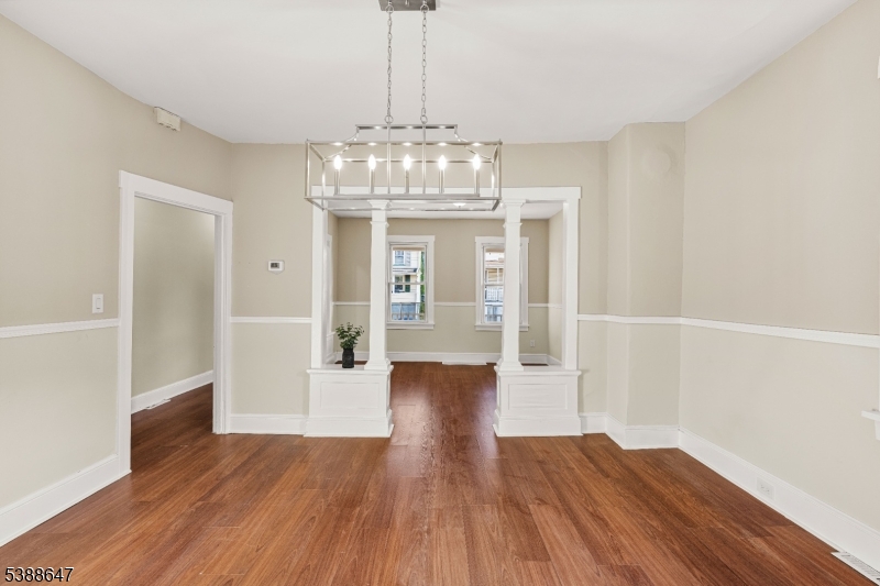330 Chambers Street Phillipsburg, NJ 08865 - Photo 9 of 27 a view of livingroom with chandelier and wooden floor