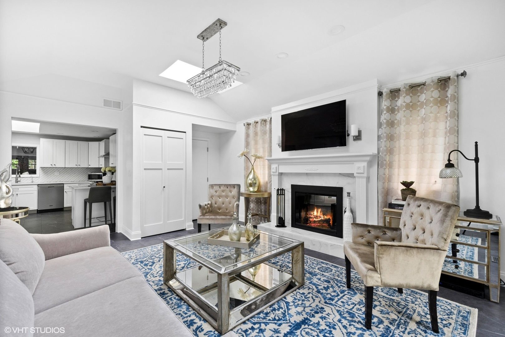 590 Old Elm Road Highland Park, IL 60035 - Photo 11 of 28 a living room with furniture a flat screen tv and a fireplace