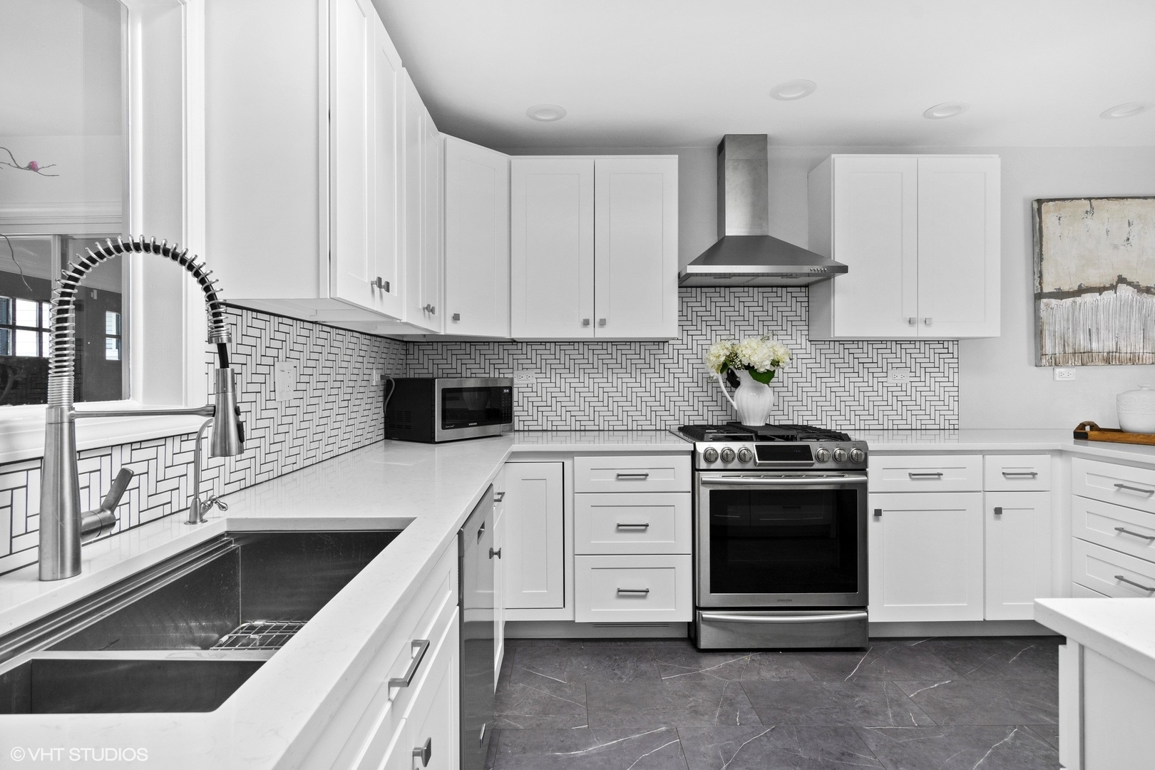 590 Old Elm Road Highland Park, IL 60035 - Photo 8 of 28 a kitchen with granite countertop a stove sink and cabinets