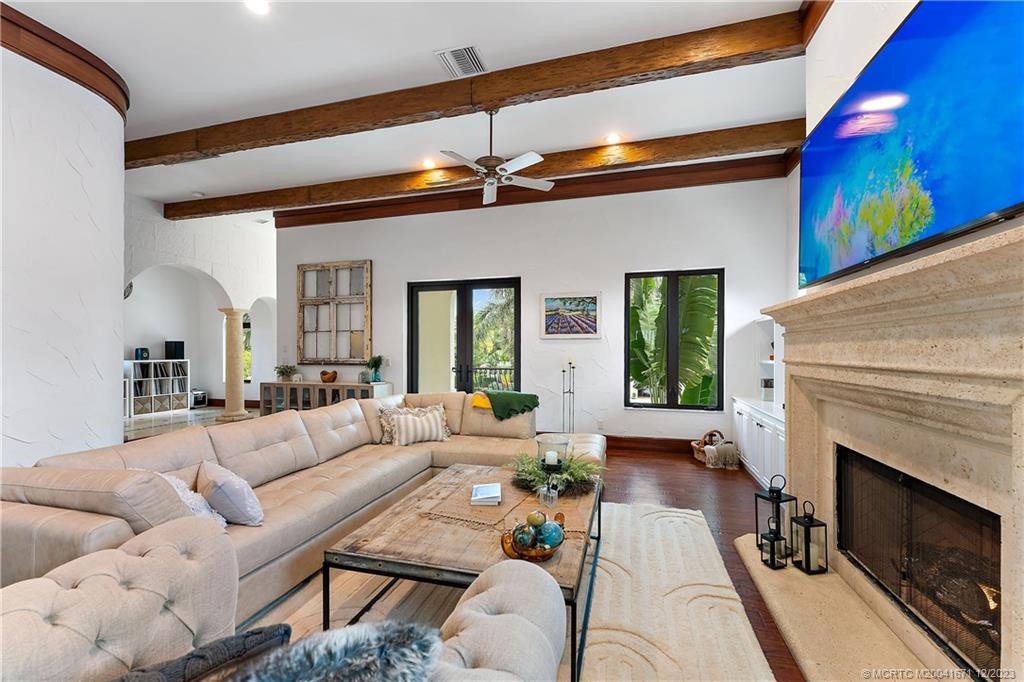 15 Middle Road Sewall's Point, FL 34996 - Photo 29 of 61 a living room with furniture and a fireplace