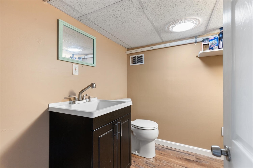 58 Saunders Street North Andover, MA 01845 - Photo 11 of 14 a bathroom with a toilet sink and mirror