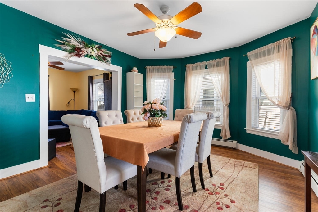 58 Saunders Street North Andover, MA 01845 - Photo 2 of 14 a dining room with furniture a chandelier and wooden floor