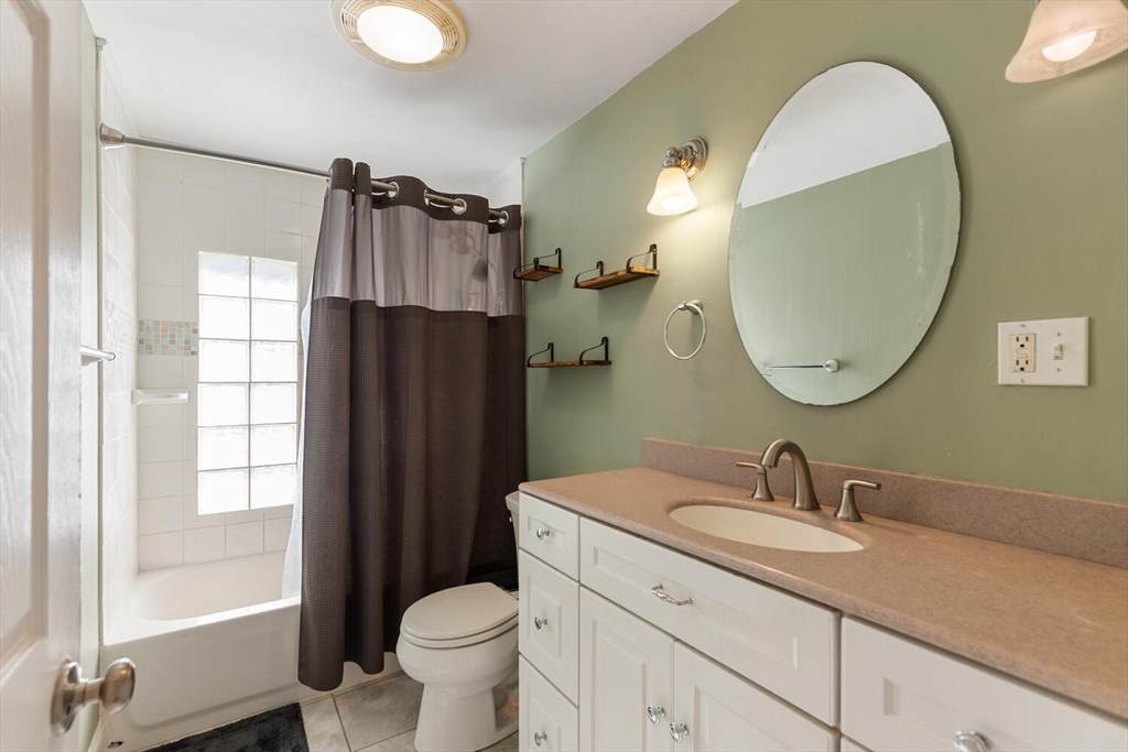 58 Saunders Street North Andover, MA 01845 - Photo 6 of 14 a bathroom with a granite countertop sink toilet and shower