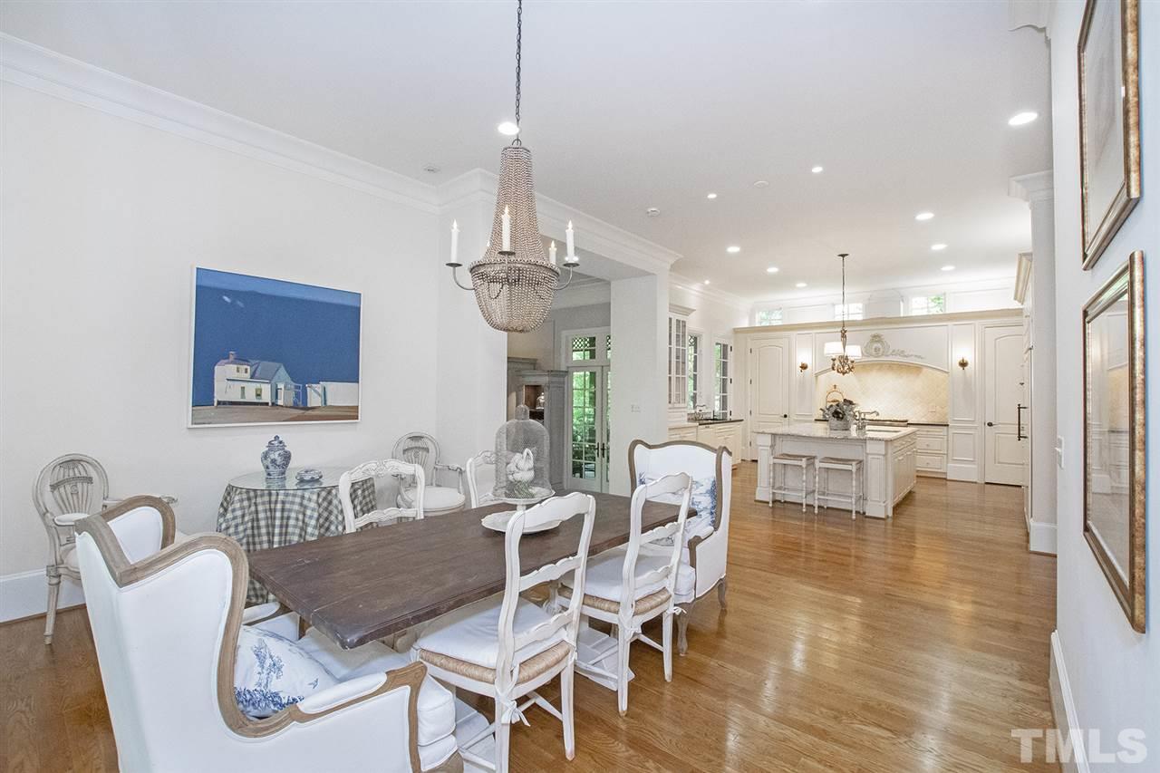 1016 Heydon Court Raleigh, NC 27614 - Photo 11 of 30 a view of a dining room and livingroom with furniture wooden floor a chandelier