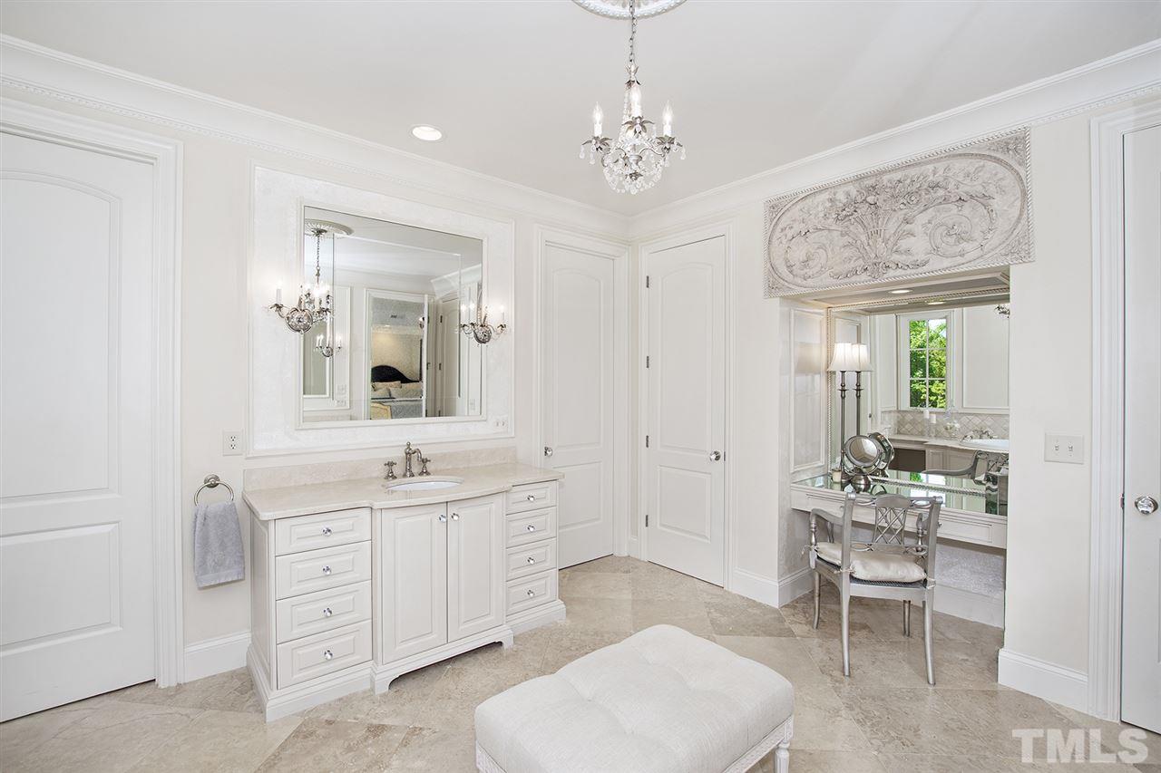 1016 Heydon Court Raleigh, NC 27614 - Photo 22 of 30 a spacious bathroom with a double vanity sink and a mirror
