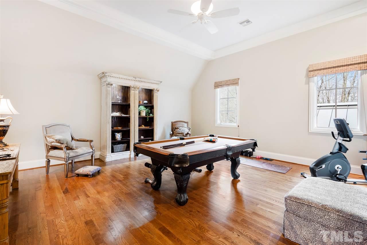 1016 Heydon Court Raleigh, NC 27614 - Photo 23 of 30 a room with furniture pool table and wooden floor