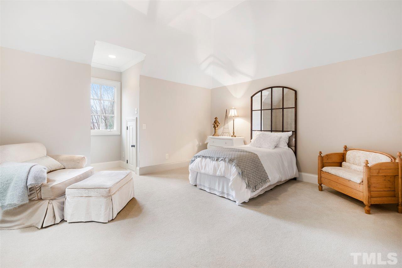 1016 Heydon Court Raleigh, NC 27614 - Photo 24 of 30 a bedroom with a bed and a couch