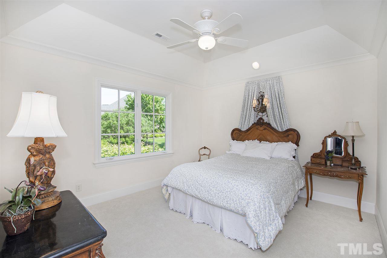 1016 Heydon Court Raleigh, NC 27614 - Photo 25 of 30 a bedroom with a bed and a window