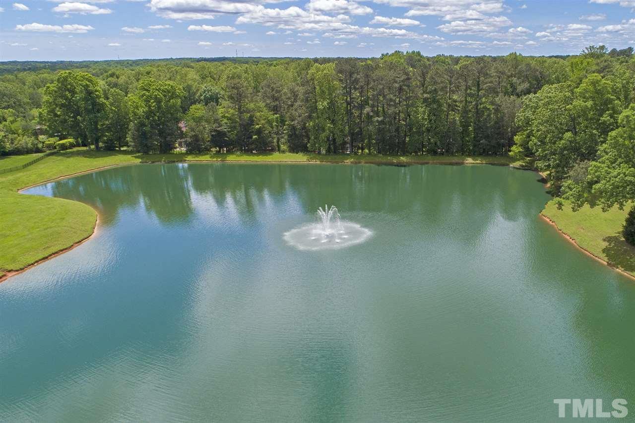 1016 Heydon Court Raleigh, NC 27614 - Photo 30 of 30 an aerial view of a house with a lake view