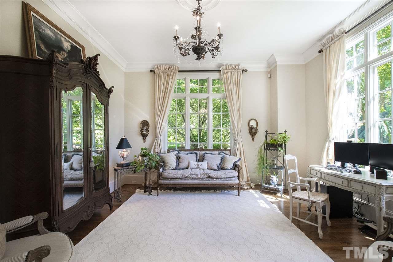 1016 Heydon Court Raleigh, NC 27614 - Photo 4 of 30 a living room with furniture fireplace and flat screen tv