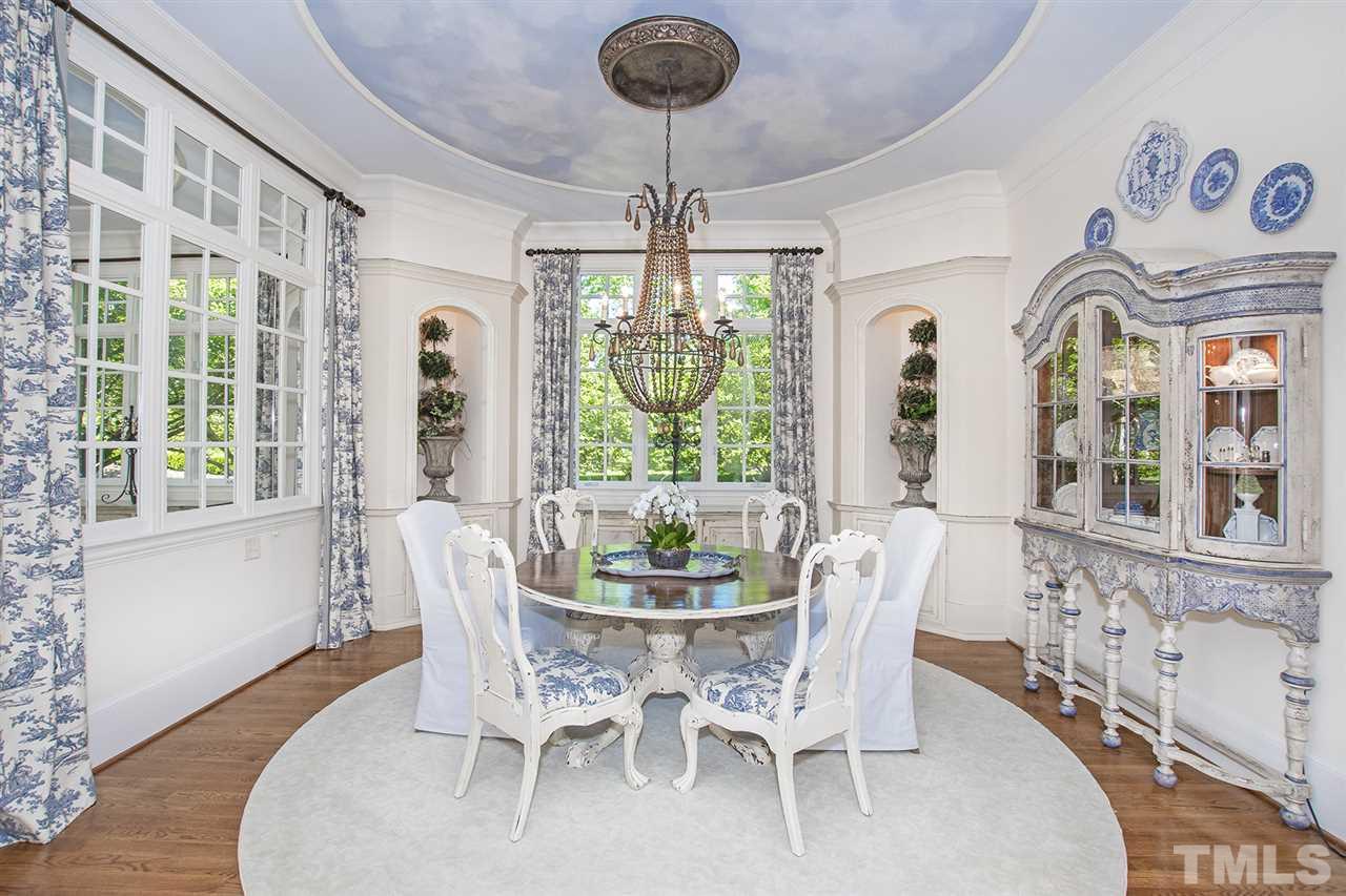 1016 Heydon Court Raleigh, NC 27614 - Photo 5 of 30 a dining room with furniture a chandelier and wooden floor