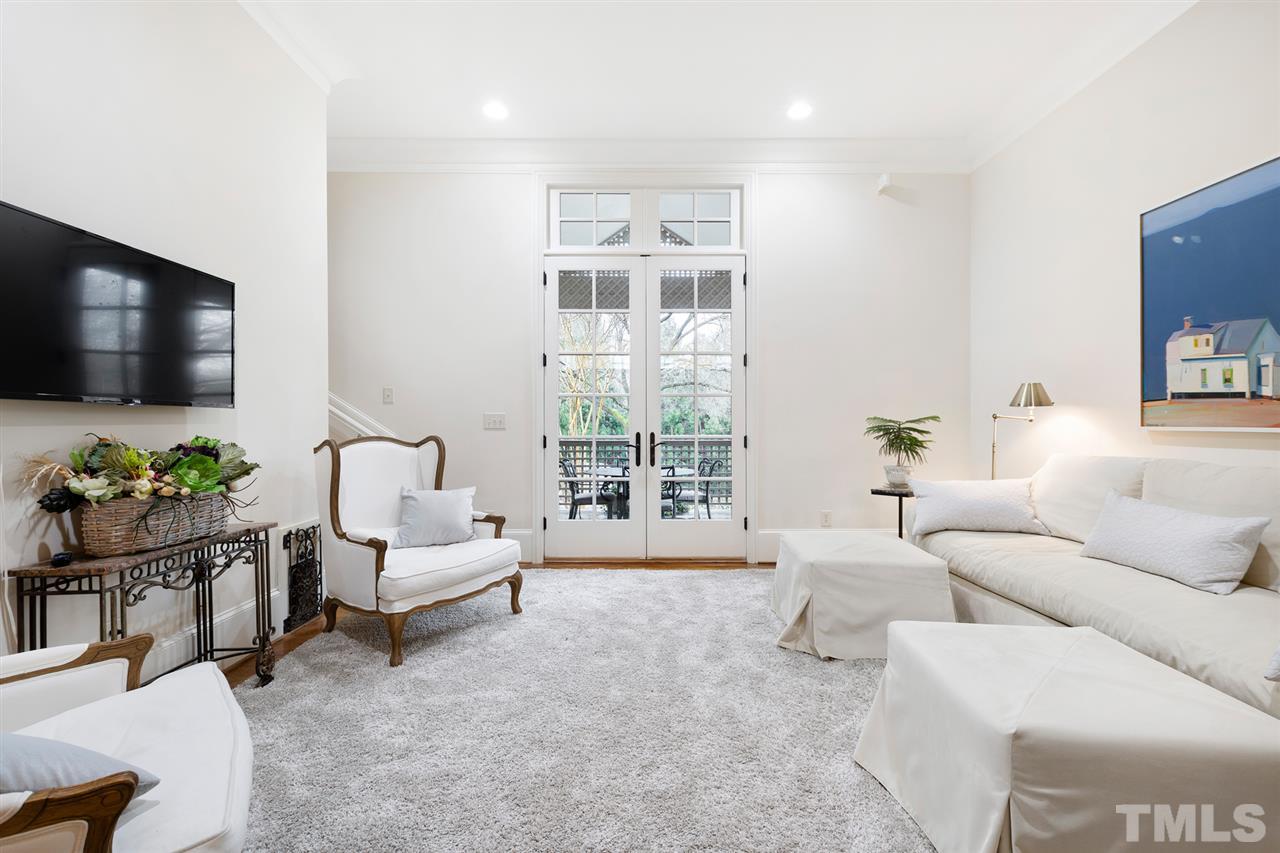 1016 Heydon Court Raleigh, NC 27614 - Photo 9 of 30 a living room with furniture and a flat screen tv