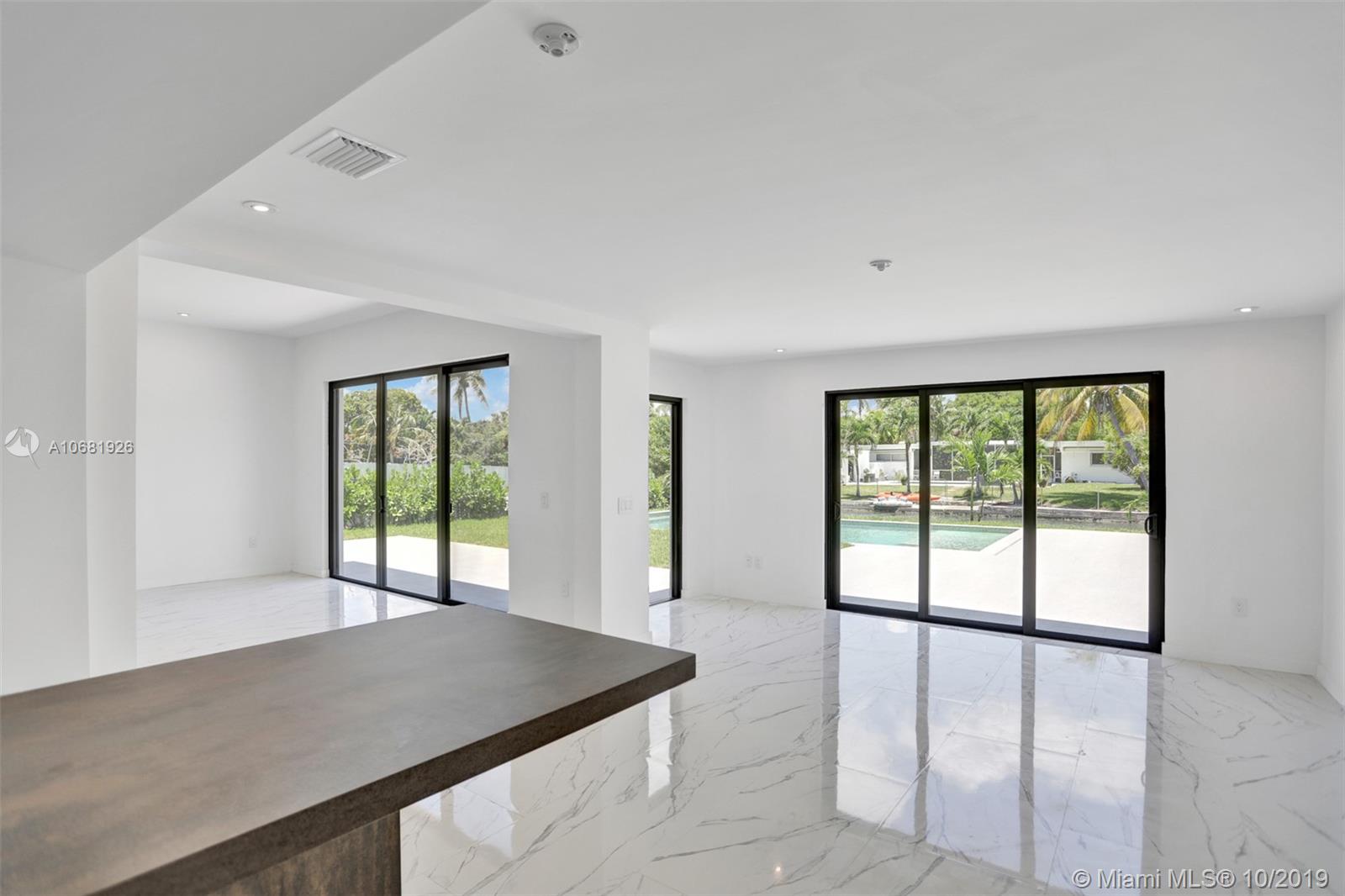1375 Daytonia Road Miami Beach, FL 33141 - Photo 4 of 12 High impact windows throughout