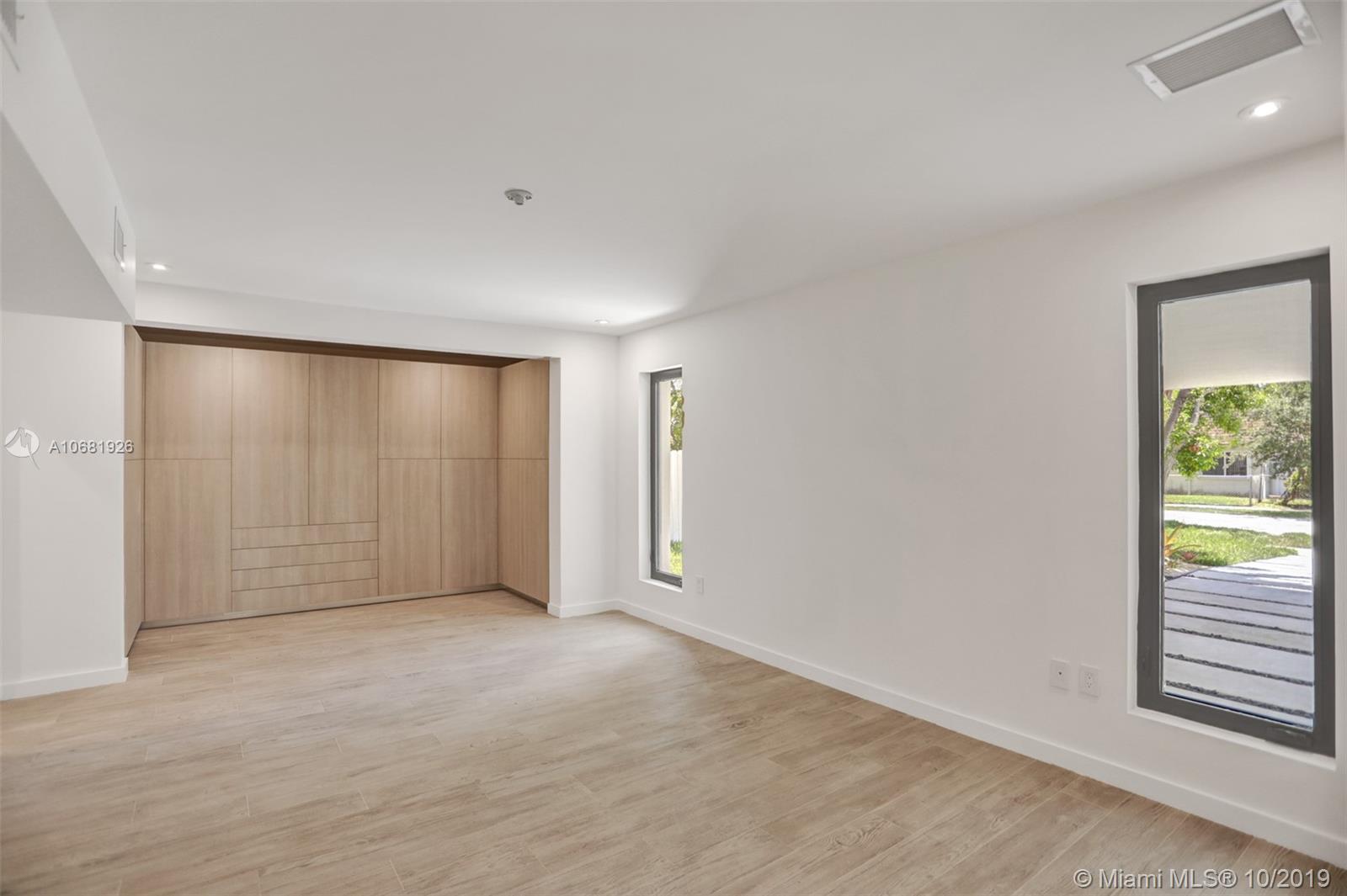 1375 Daytonia Road Miami Beach, FL 33141 - Photo 5 of 12 Master bedroom with Porcelain wood floors and Custom made Italian closets