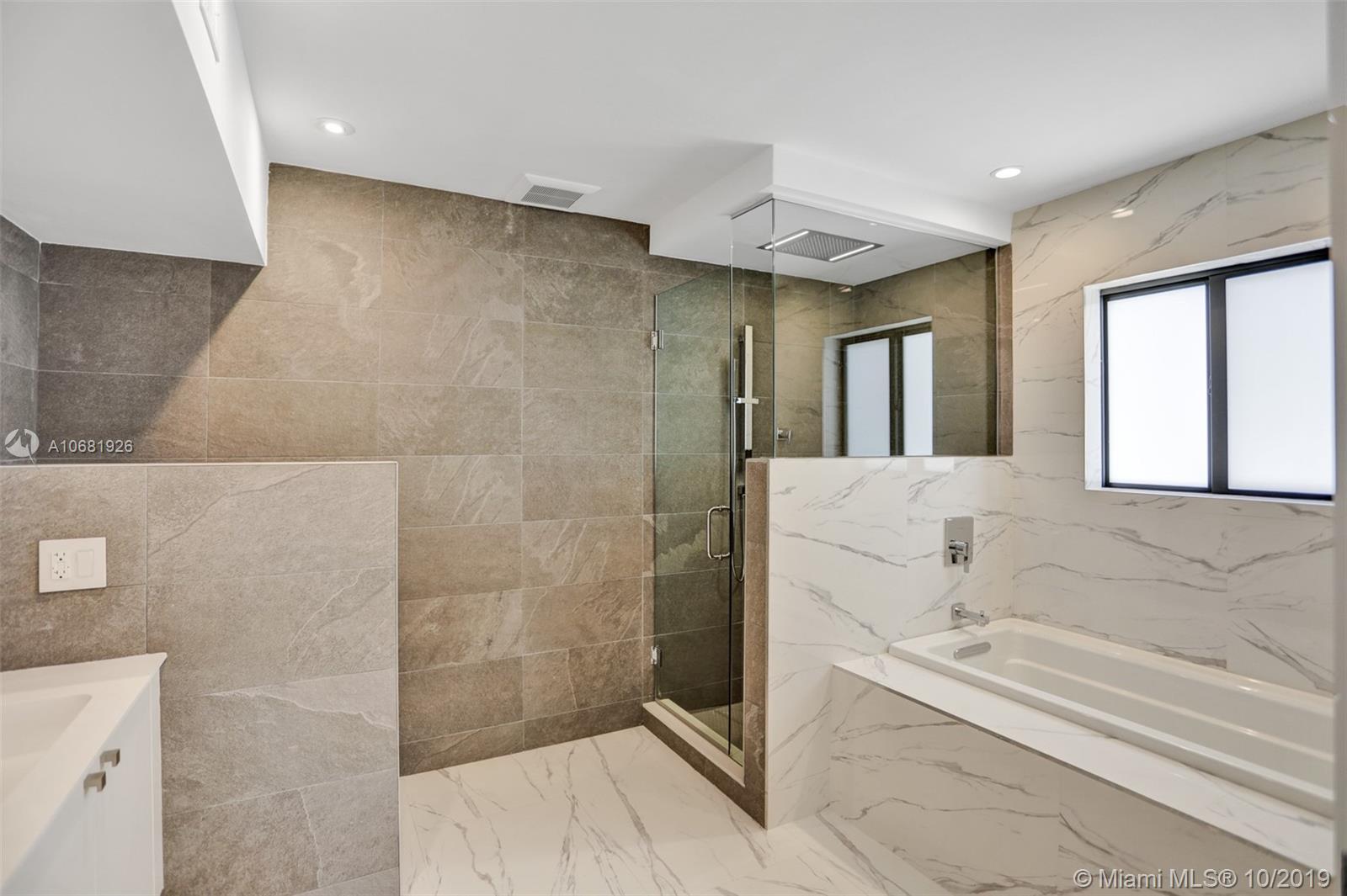 1375 Daytonia Road Miami Beach, FL 33141 - Photo 6 of 12 Mater BAthroom with separate Shower and tub