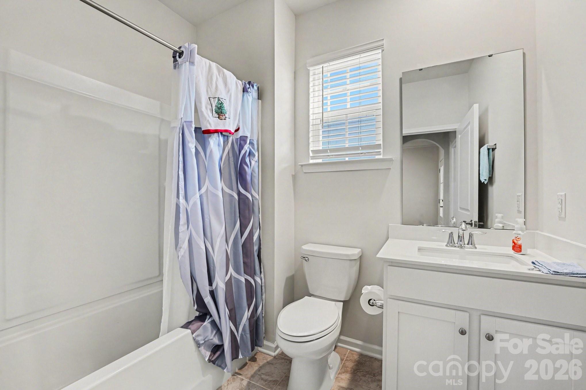 2971 Findley Road Statesville, NC 28625 - Photo 19 of 19 a white toilet sitting next to a bathroom sink