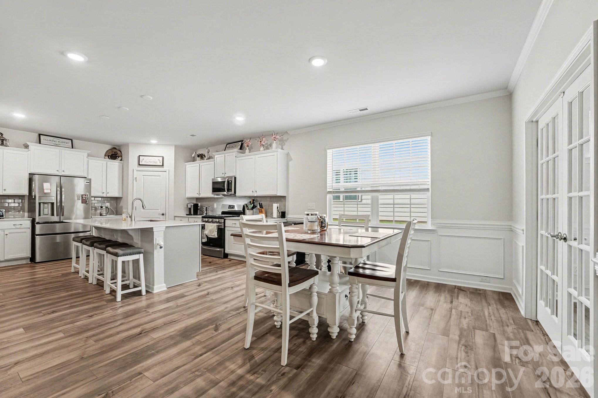 2971 Findley Road Statesville, NC 28625 - Photo 4 of 19 a view of a dining room with furniture and wooden floor