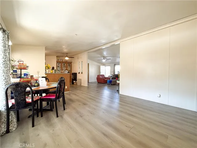 a view of a dining room with furniture and a livingroom
