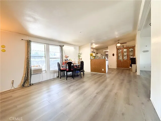 a view of a livingroom with furniture and a window