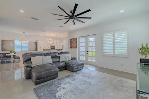 a balcony with chairs and wooden floor