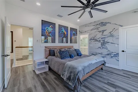 a bathroom with a double vanity sink mirror and shower