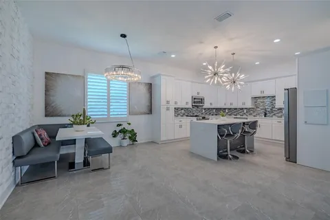 a view of a livingroom with furniture and a chandelier