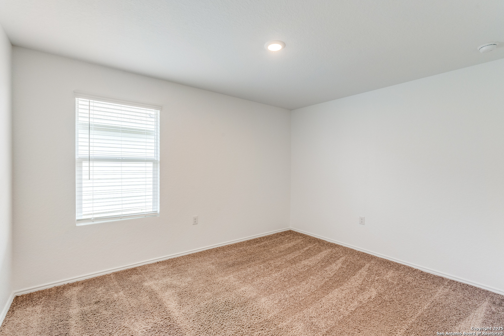 13503 Turnesa Terrace San Antonio, TX 78221 - Photo 12 of 25 an empty room with a window