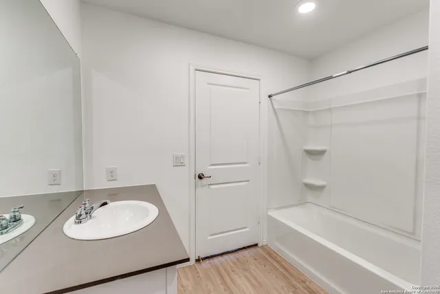 a bathroom with a sink and a mirror