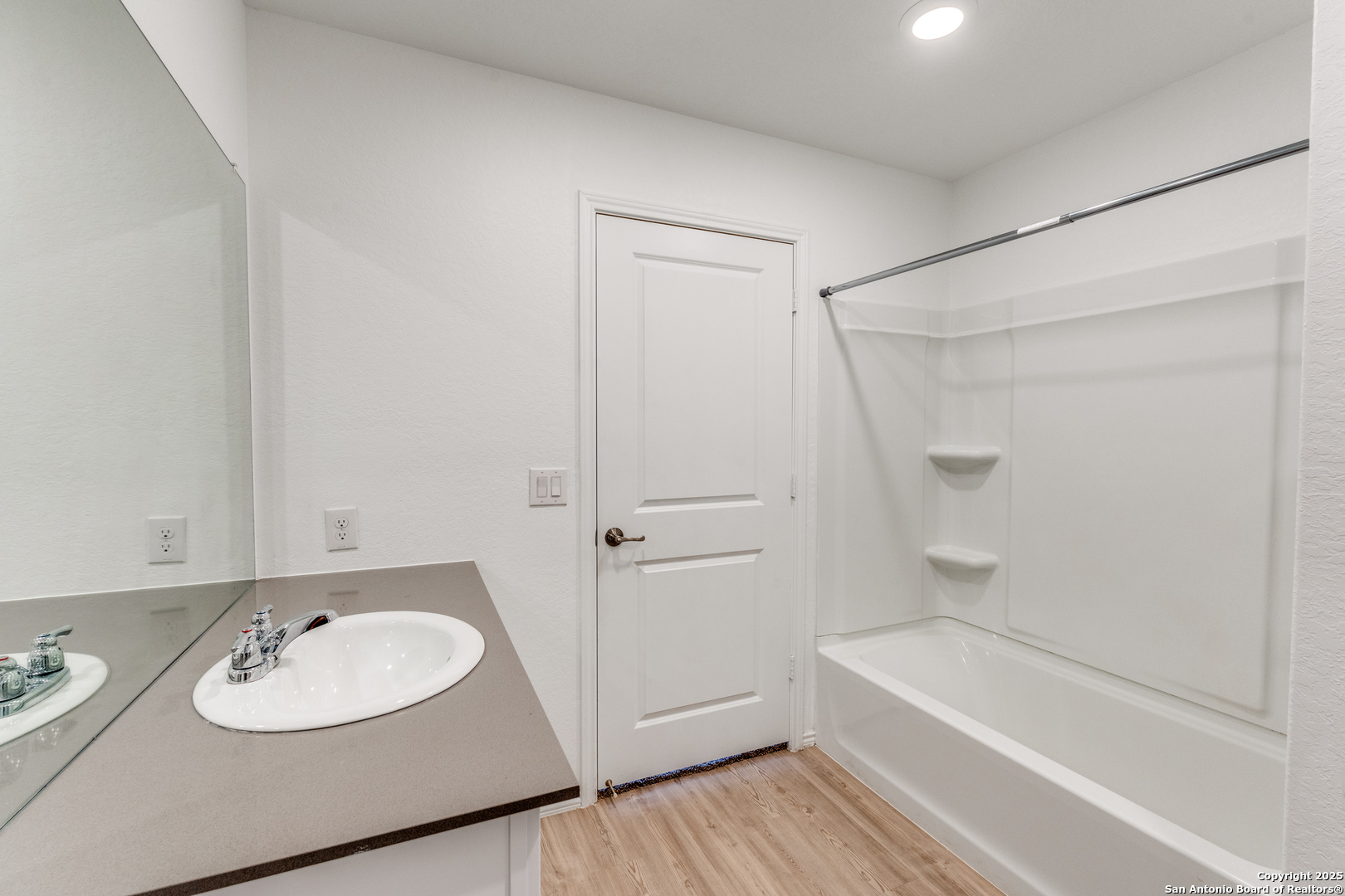 13503 Turnesa Terrace San Antonio, TX 78221 - Photo 13 of 25 a bathroom with a sink and a mirror