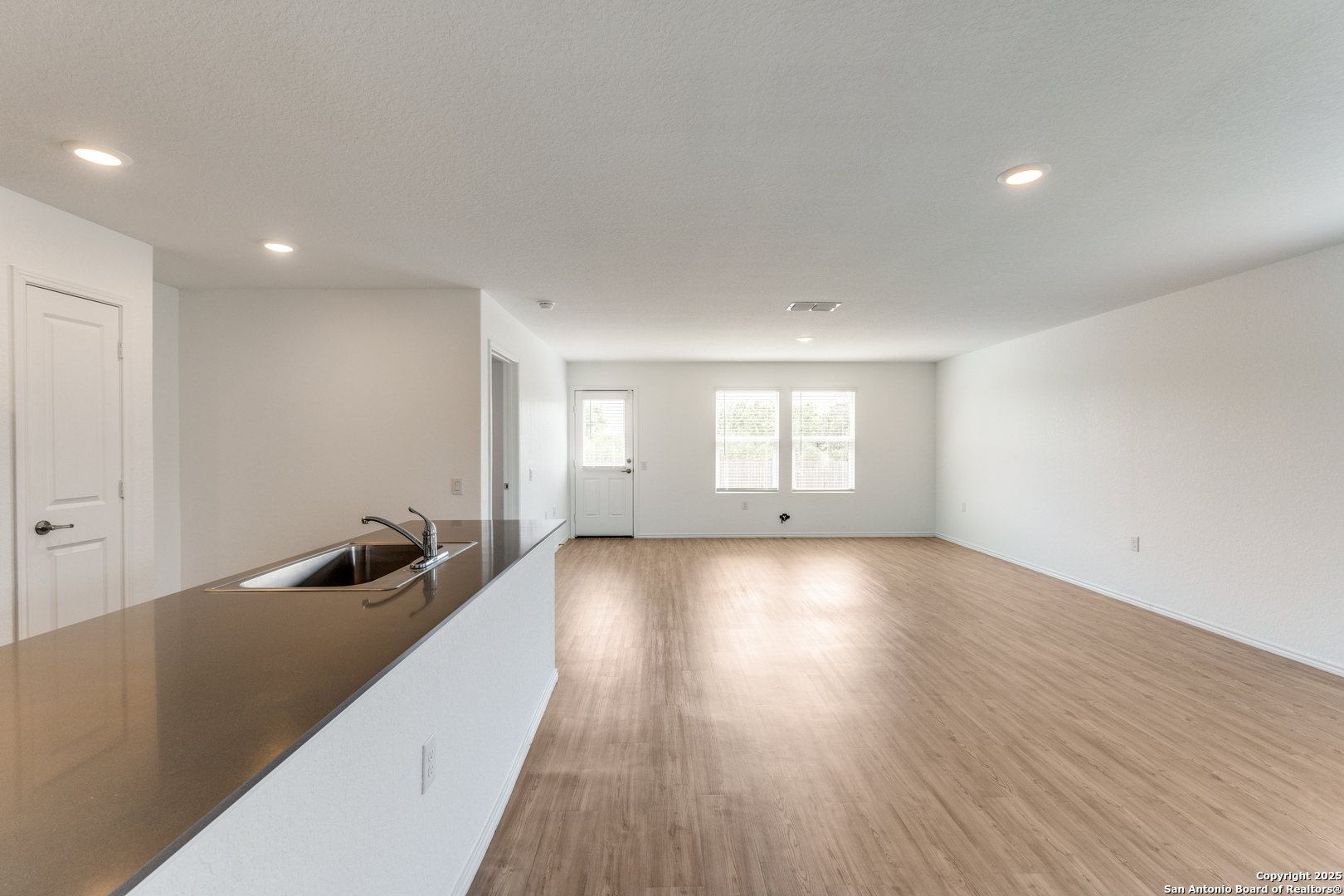 13503 Turnesa Terrace San Antonio, TX 78221 - Photo 20 of 25 a view of a room with window and wooden floor
