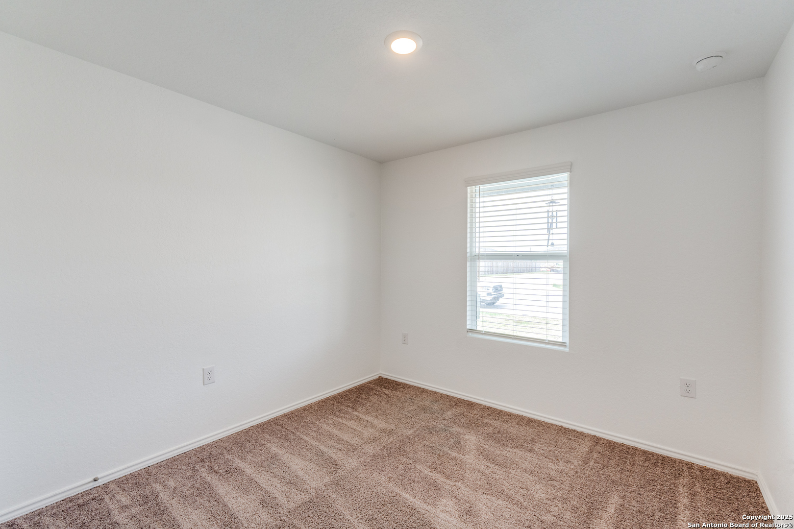 13503 Turnesa Terrace San Antonio, TX 78221 - Photo 8 of 25 an empty room with a window