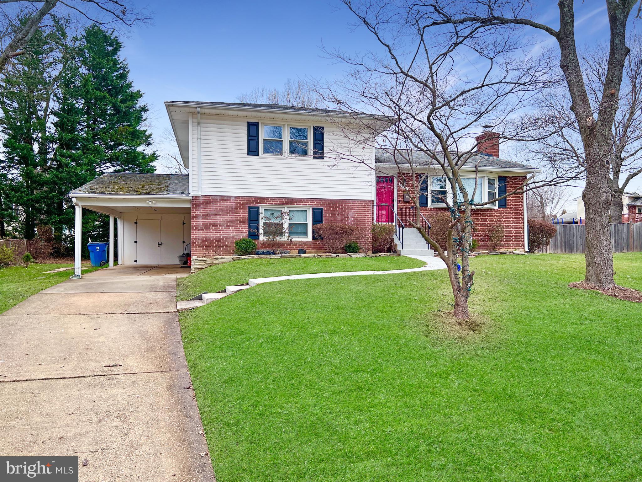 7114 Xavier Court McLean, VA 22101 - Photo 1 of 22 a front view of a house with a yard and trees