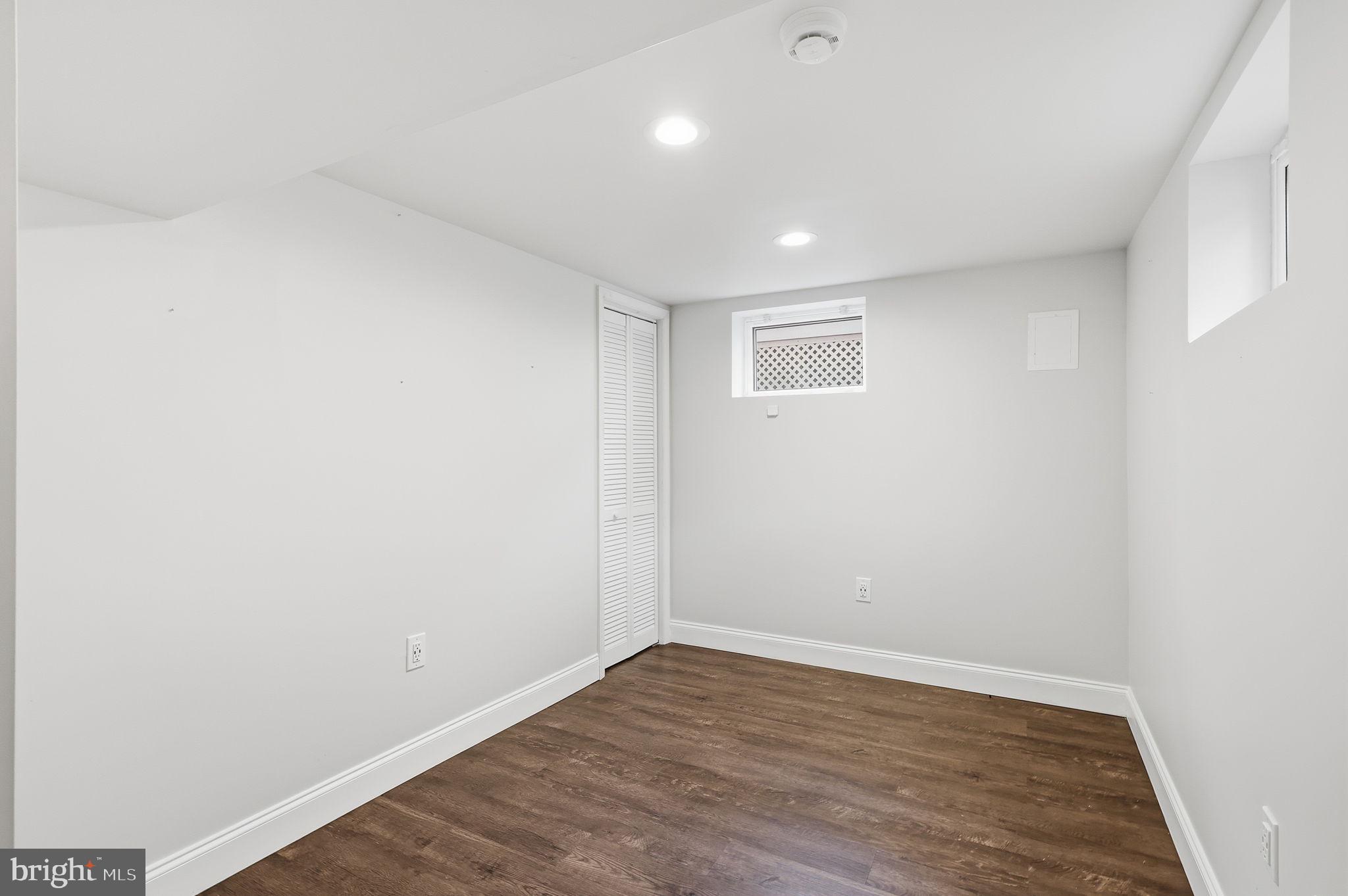 7114 Xavier Court McLean, VA 22101 - Photo 15 of 22 a view of an empty room with wooden floor