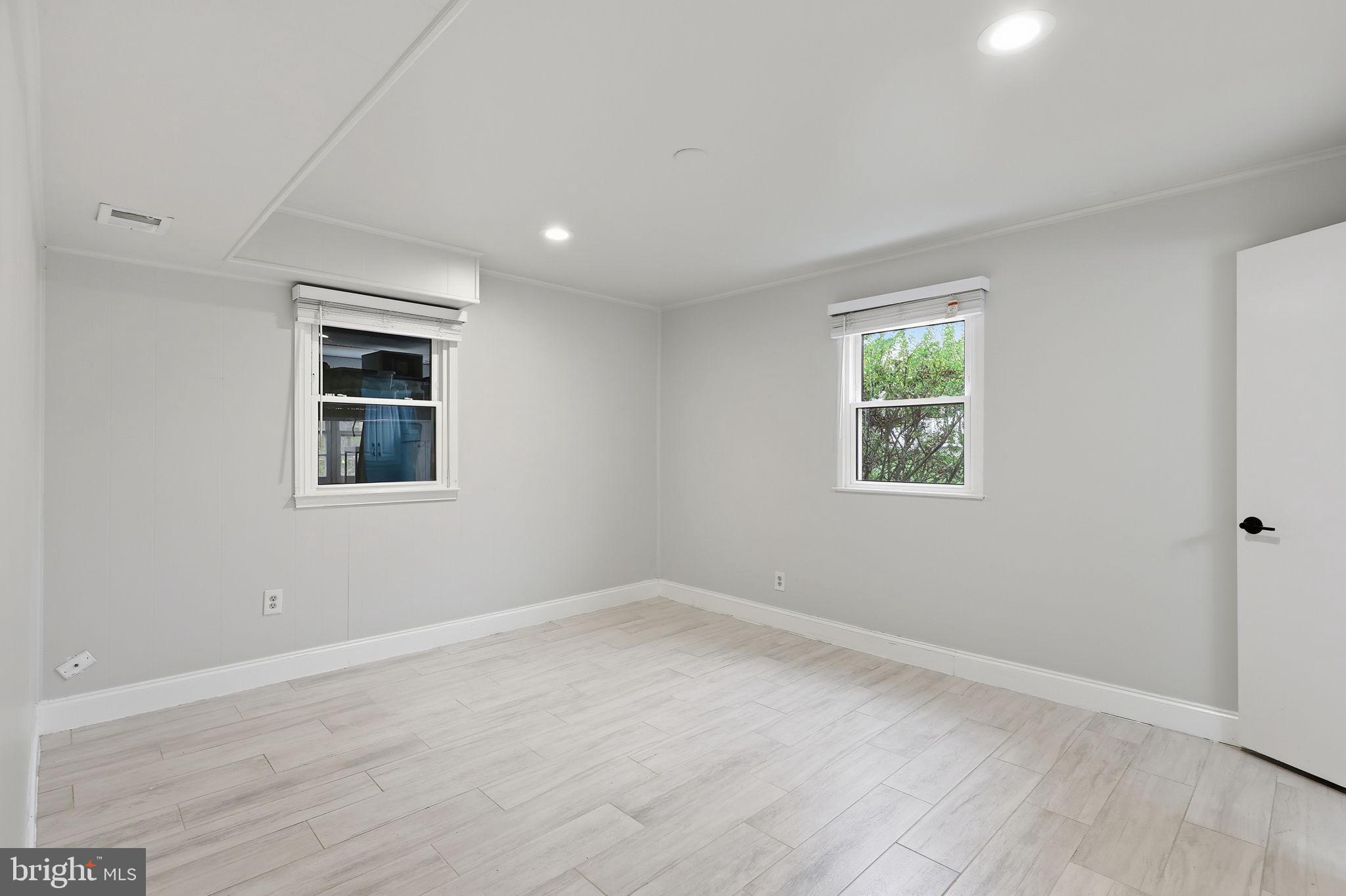 7114 Xavier Court McLean, VA 22101 - Photo 21 of 22 a view of a room with wooden floor and windows