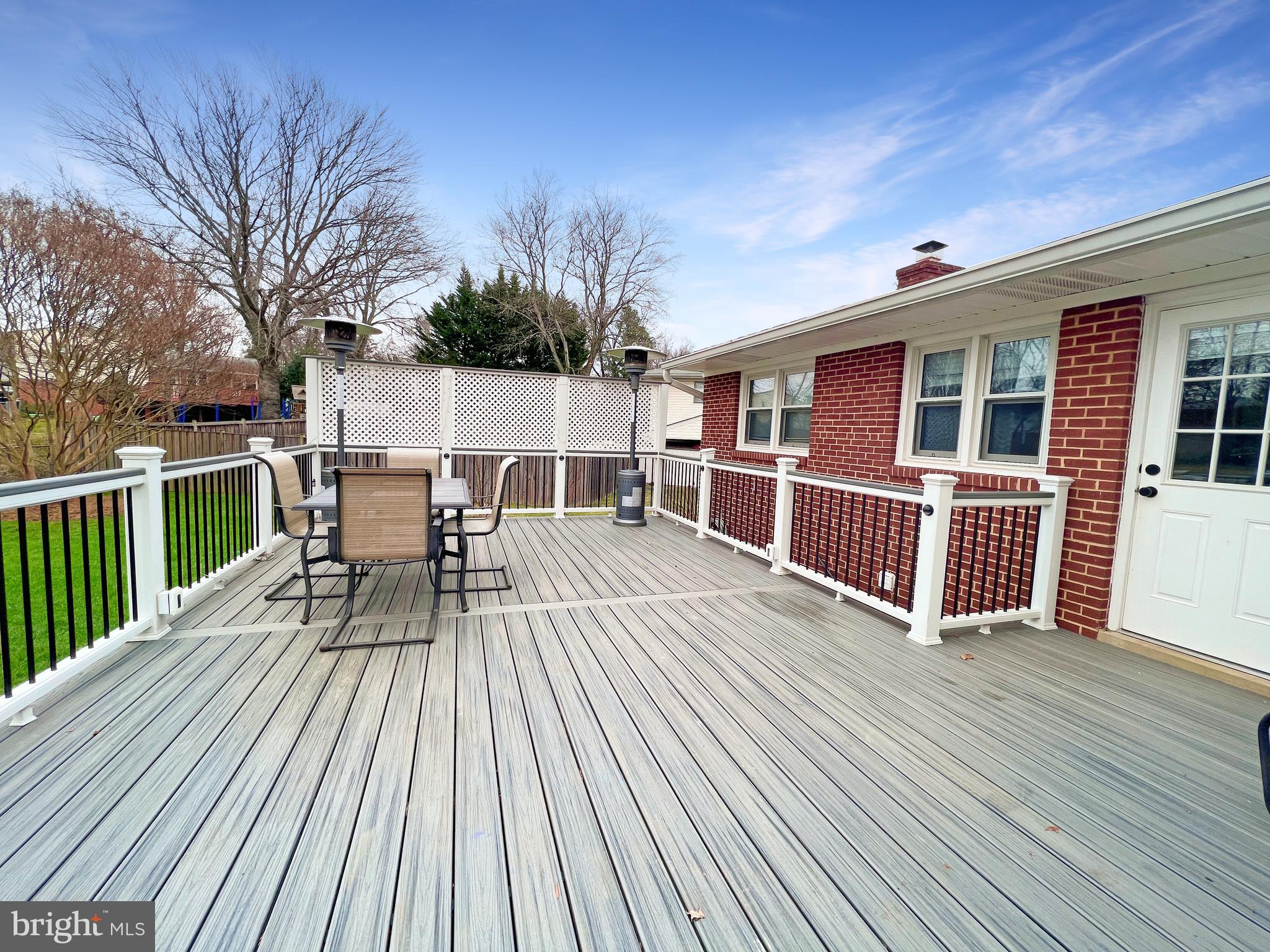 7114 Xavier Court McLean, VA 22101 - Photo 3 of 22 a view of a house with wooden deck and furniture