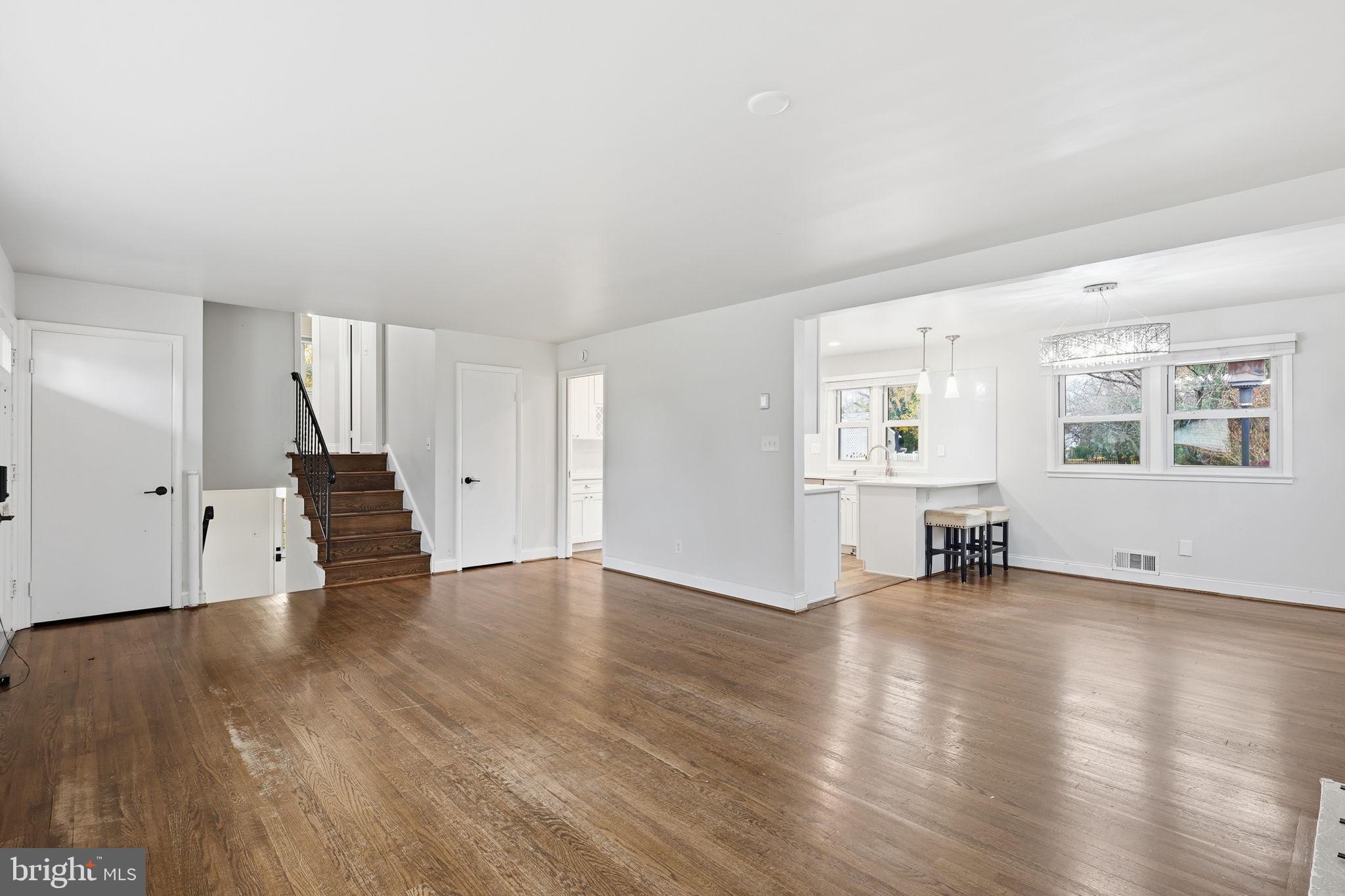 7114 Xavier Court McLean, VA 22101 - Photo 6 of 22 an empty room with wooden floor and windows