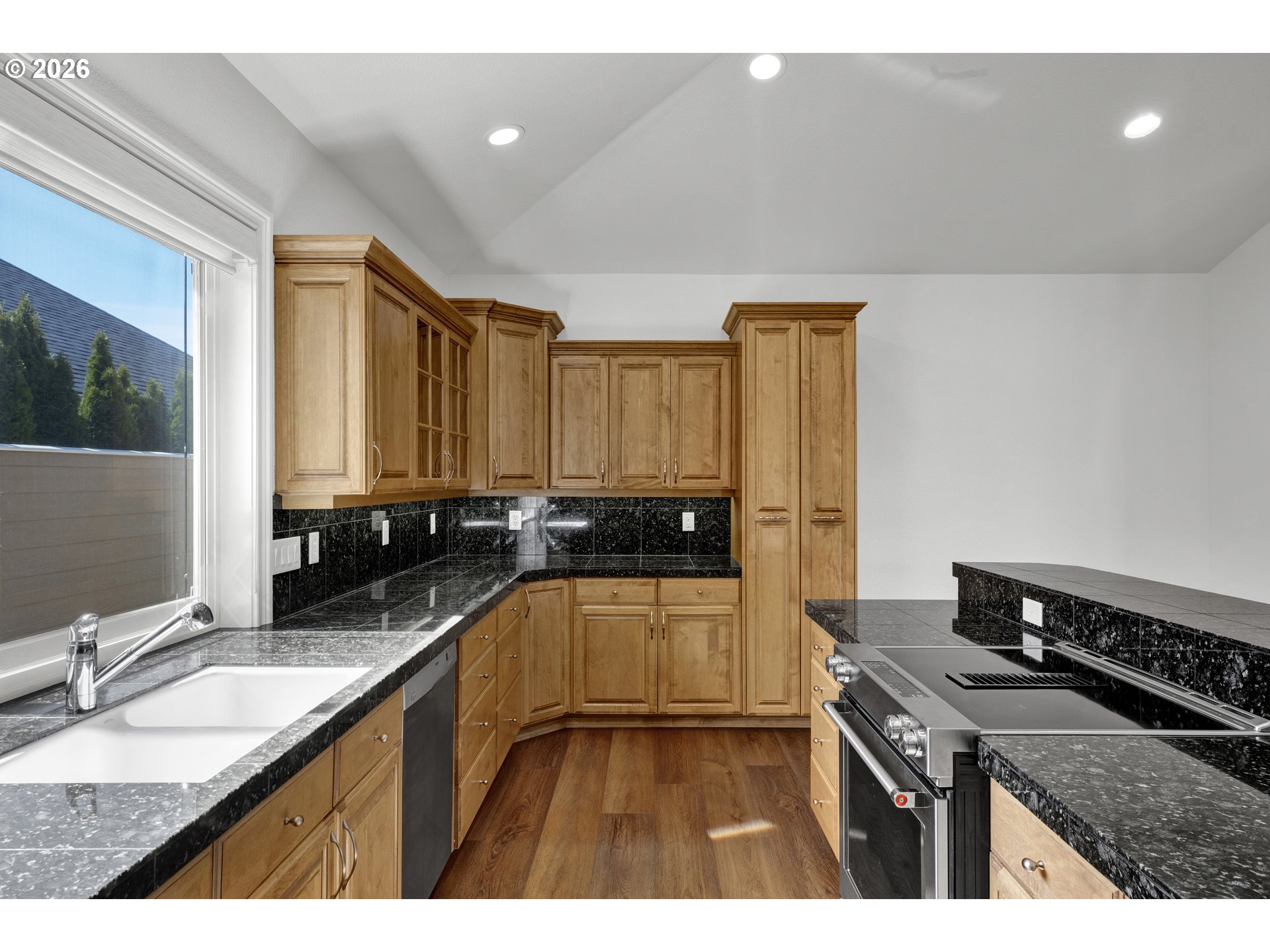 2116 Willow Loop East Florence, OR 97439 - Photo 15 of 47 a kitchen with a sink appliances and cabinets