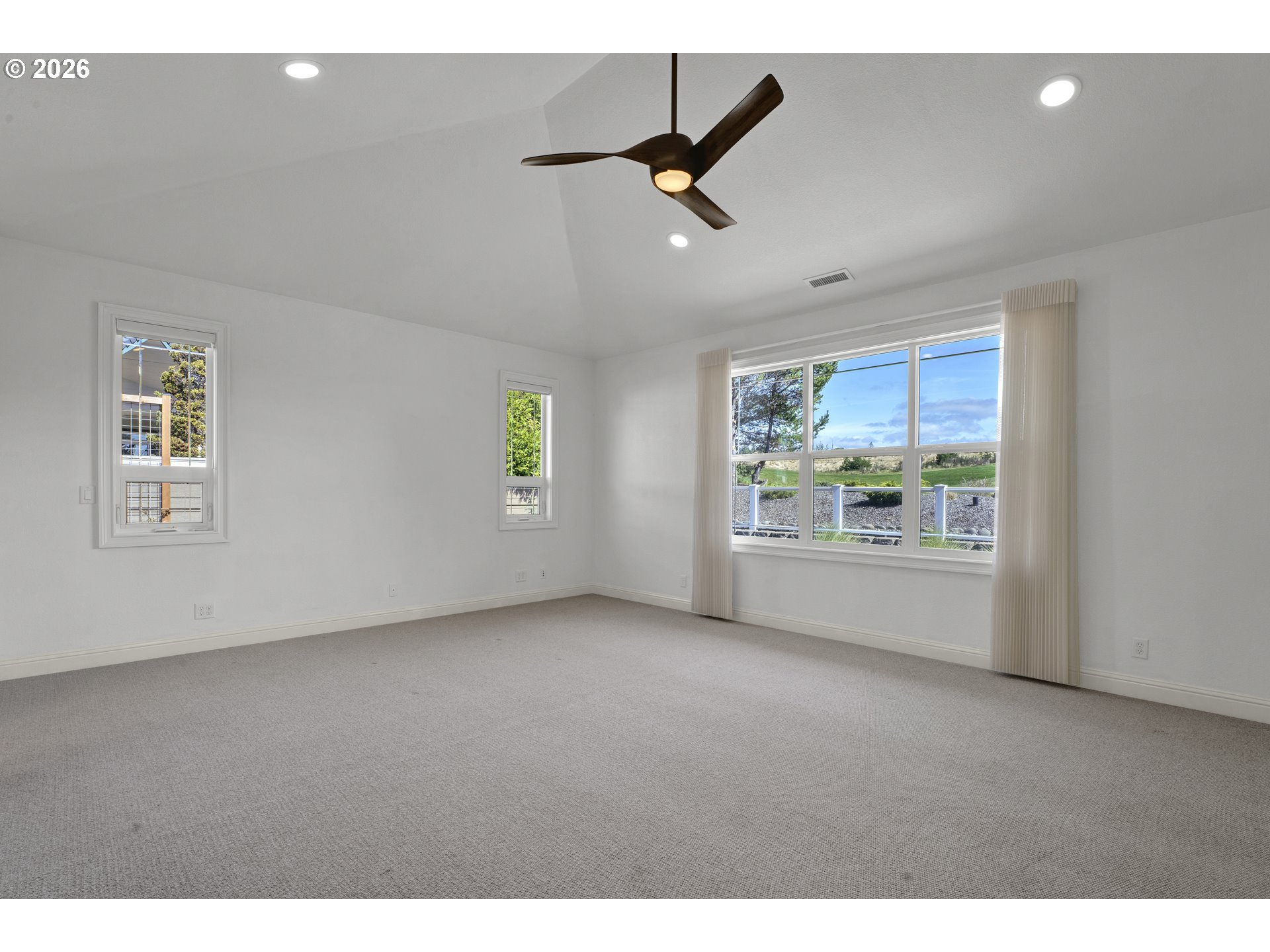 2116 Willow Loop East Florence, OR 97439 - Photo 17 of 47 a view of an empty room with a window