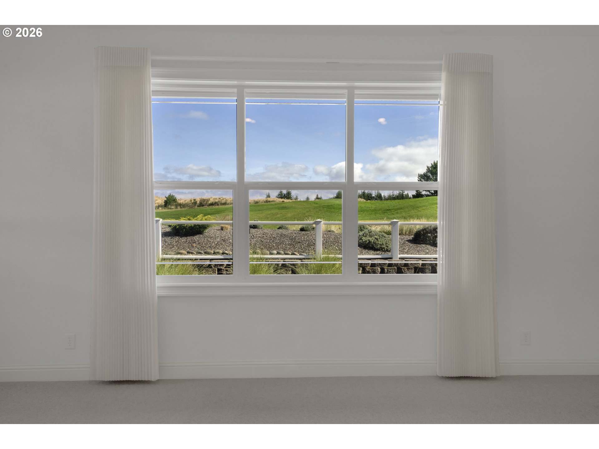 2116 Willow Loop East Florence, OR 97439 - Photo 19 of 47 a view of an empty room with a window