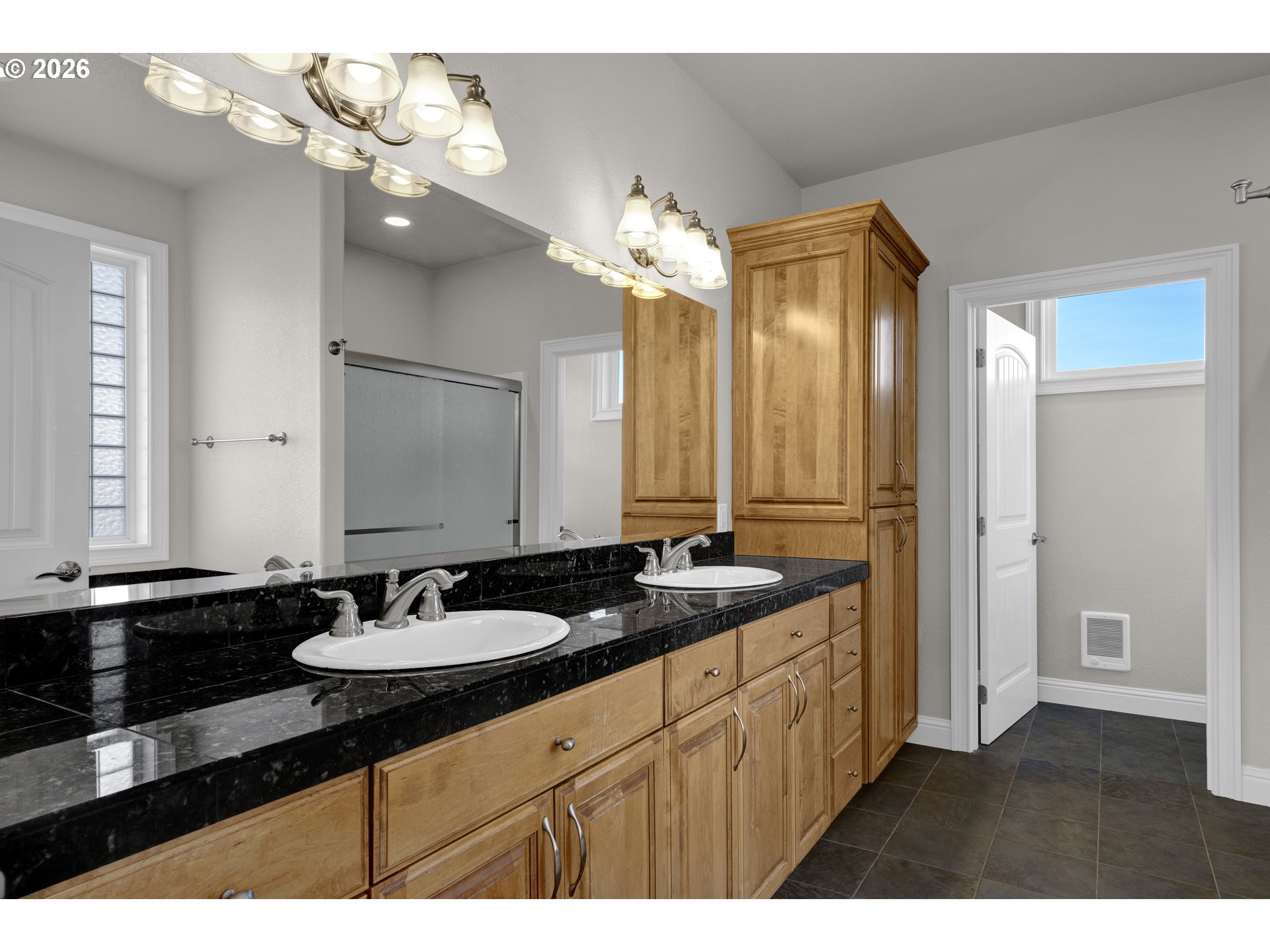 2116 Willow Loop East Florence, OR 97439 - Photo 20 of 47 a bathroom with a sink double vanity granite and a mirror