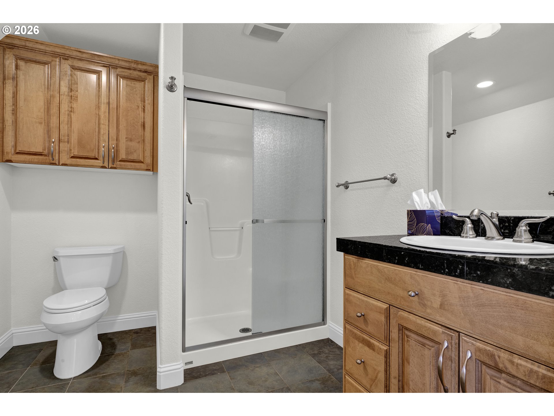 2116 Willow Loop East Florence, OR 97439 - Photo 27 of 47 a bathroom with a granite countertop sink toilet and shower