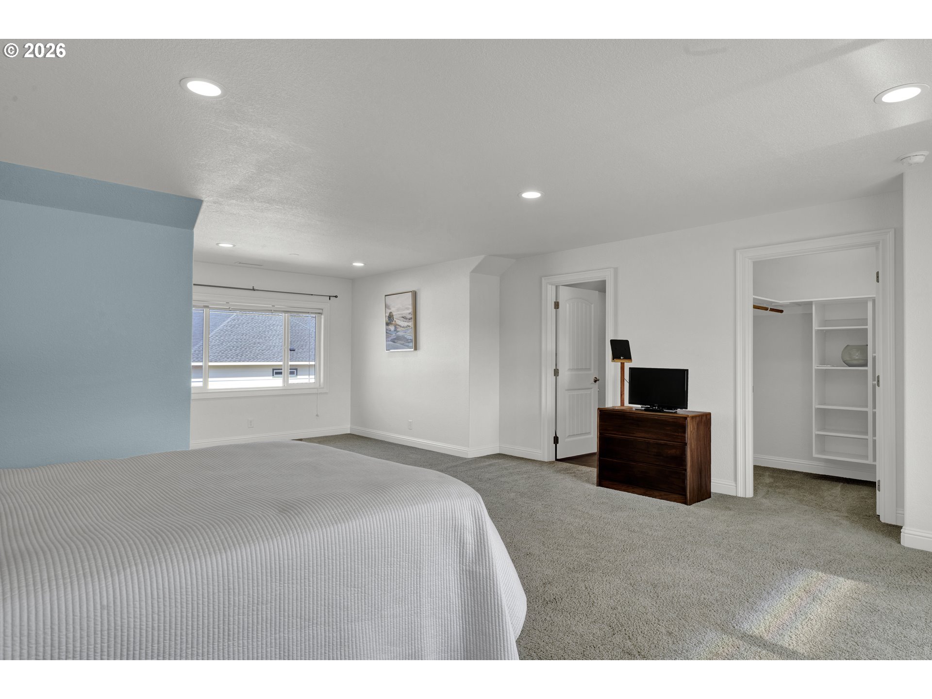 2116 Willow Loop East Florence, OR 97439 - Photo 32 of 47 a bedroom with a bed and a television