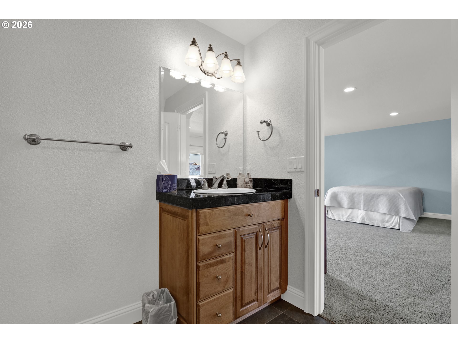 2116 Willow Loop East Florence, OR 97439 - Photo 33 of 47 a bathroom with a sink vanity and a mirror