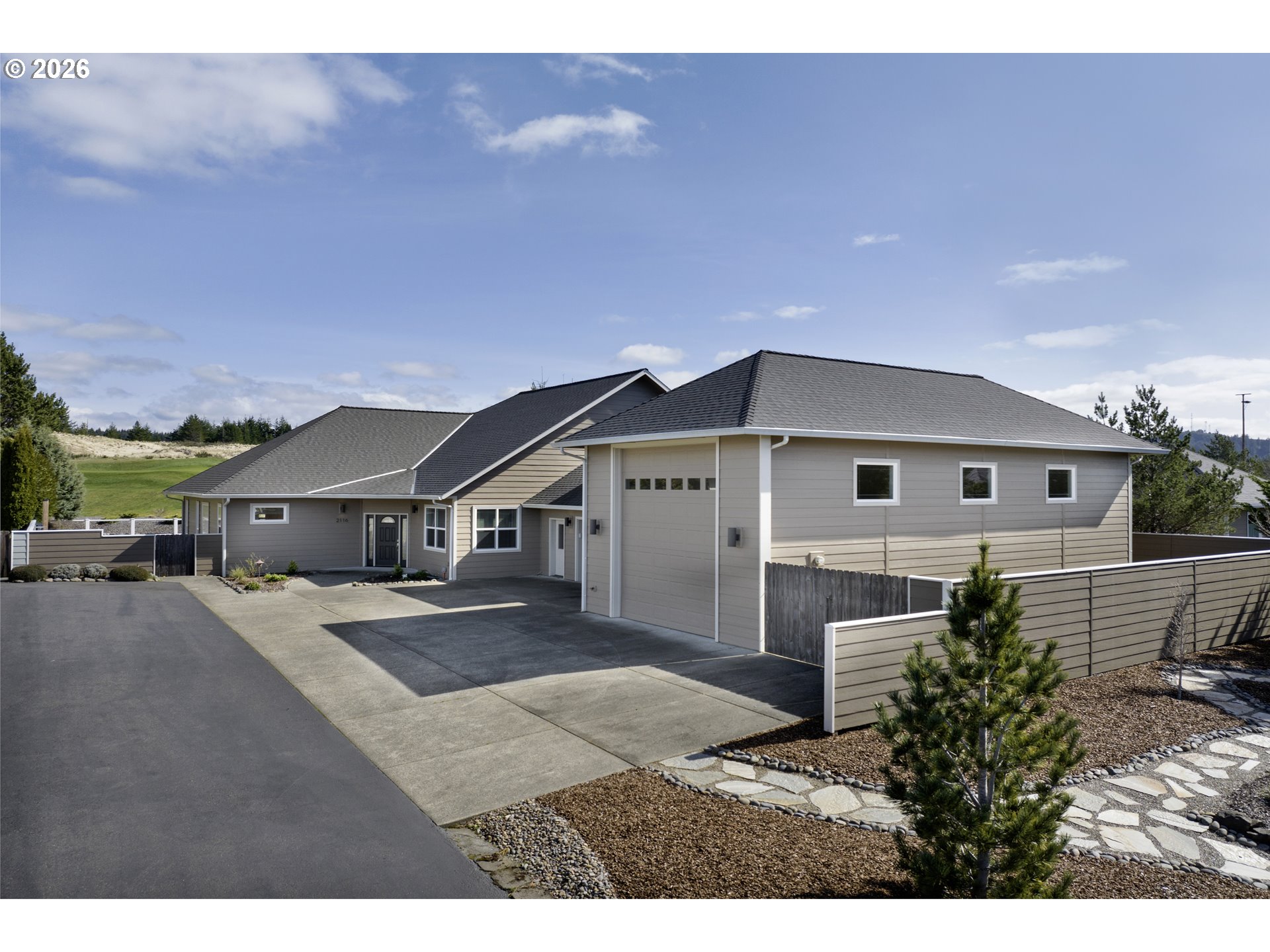 2116 Willow Loop East Florence, OR 97439 - Photo 4 of 47 a house view with a outdoor space