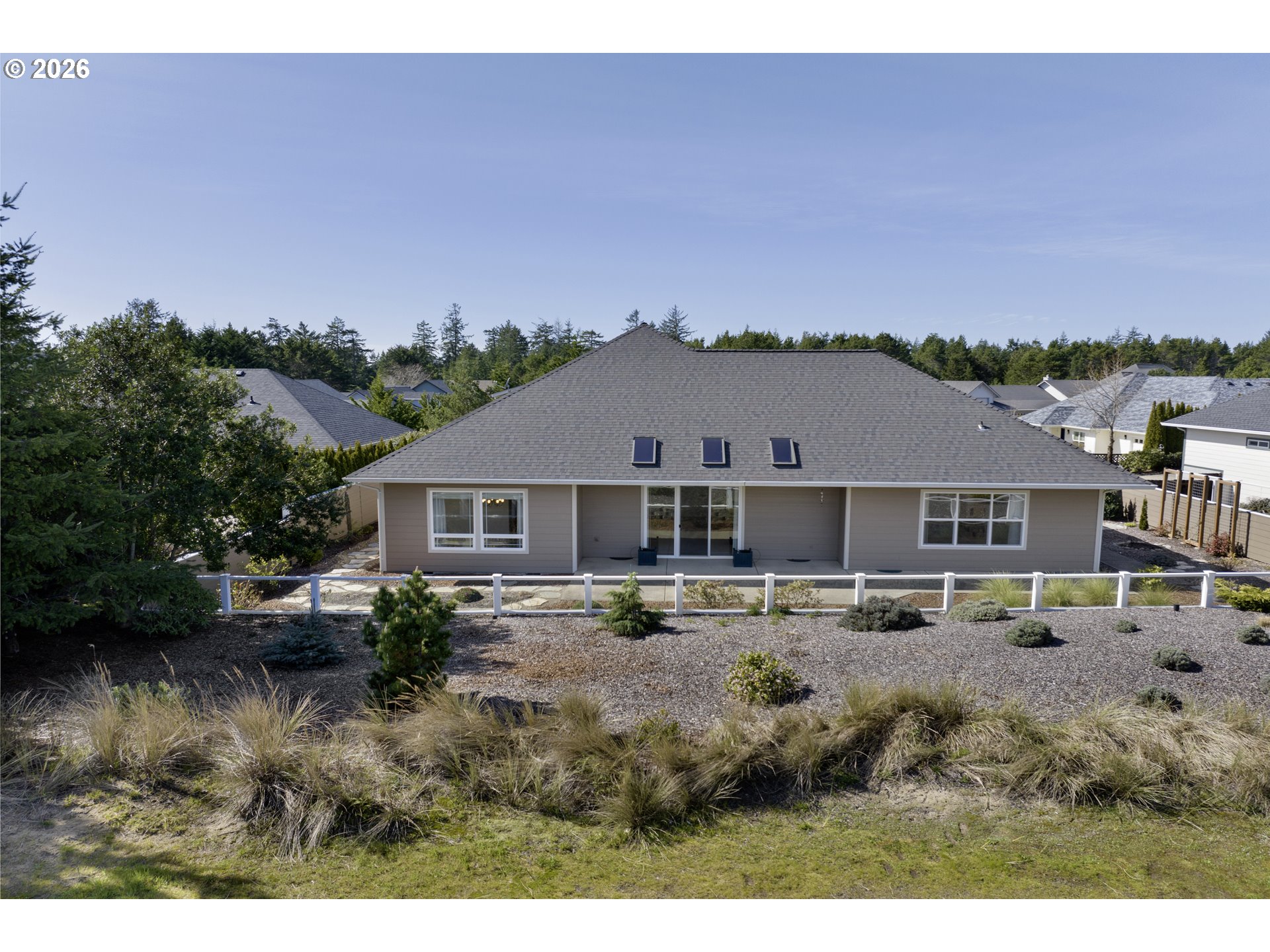 2116 Willow Loop East Florence, OR 97439 - Photo 42 of 47 a view of house with outdoor space and yard