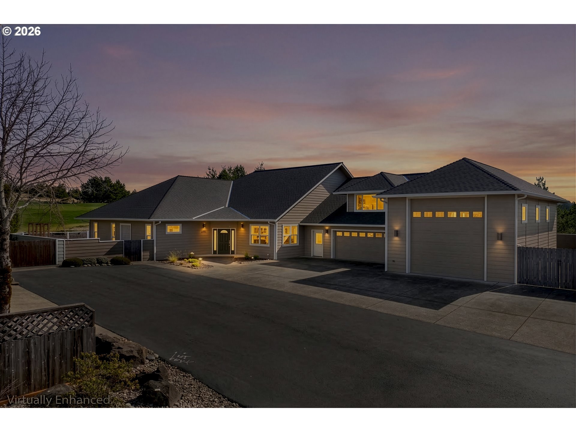 2116 Willow Loop East Florence, OR 97439 - Photo 46 of 47 a front view of a house with a yard and garage