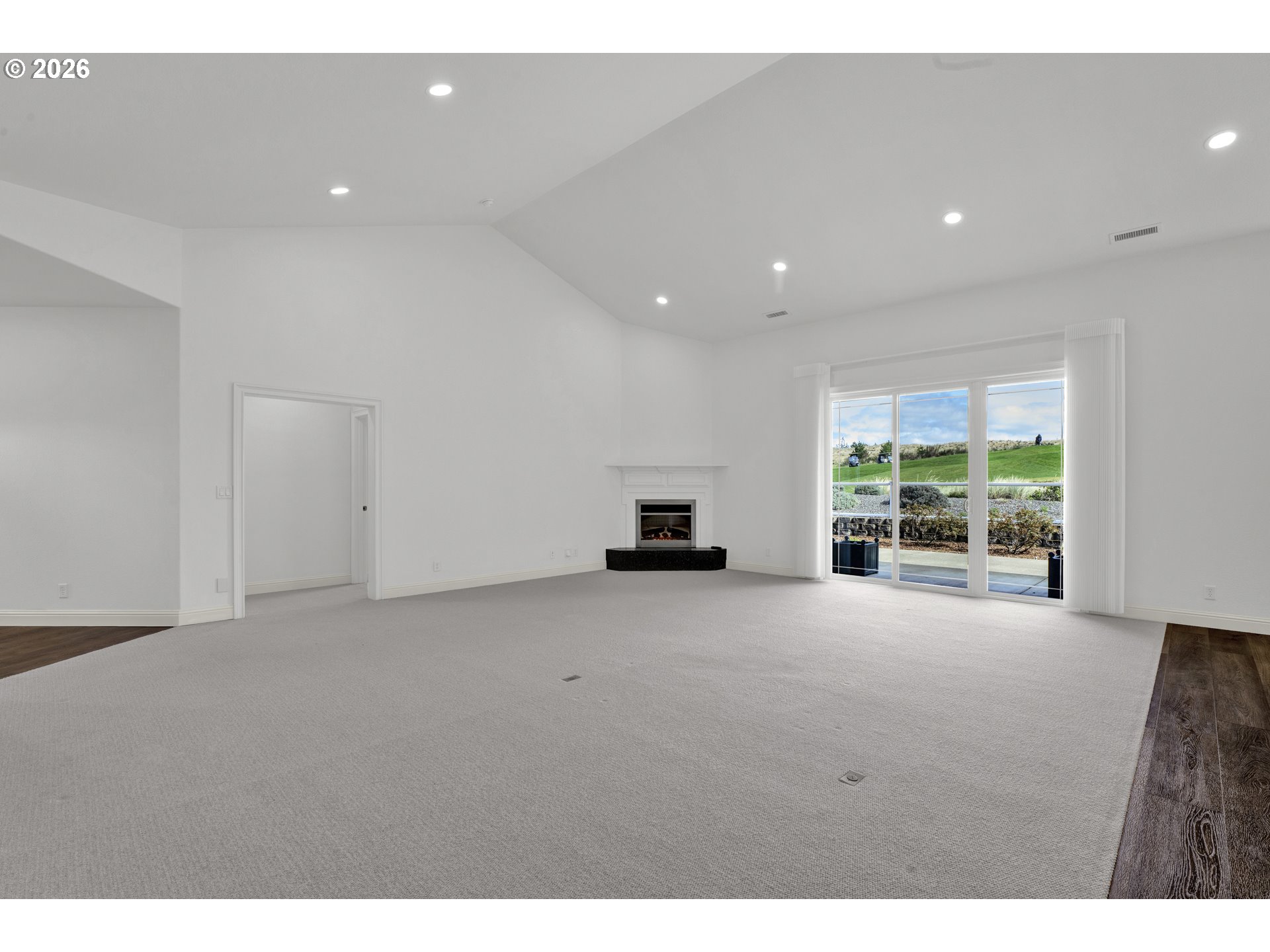 2116 Willow Loop East Florence, OR 97439 - Photo 10 of 47 a view of an empty room with a window