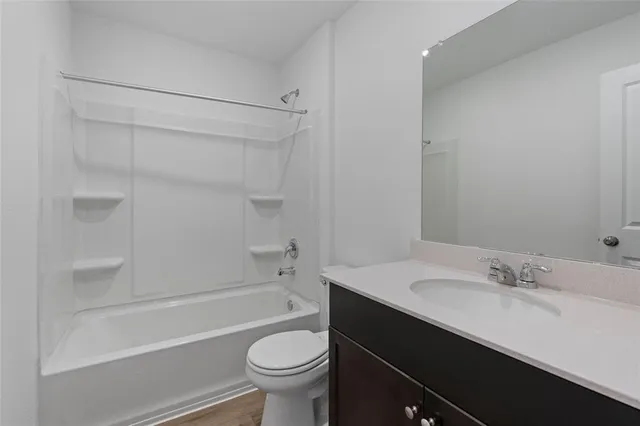 a bathroom with a sink a toilet and a bathtub